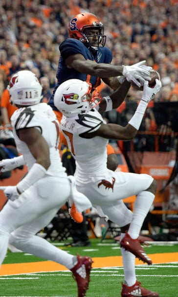 No. 13 Syracuse beats Louisville 54-23 _ perfect in dome